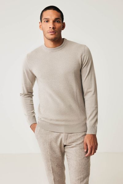 Beige merino trui structuur