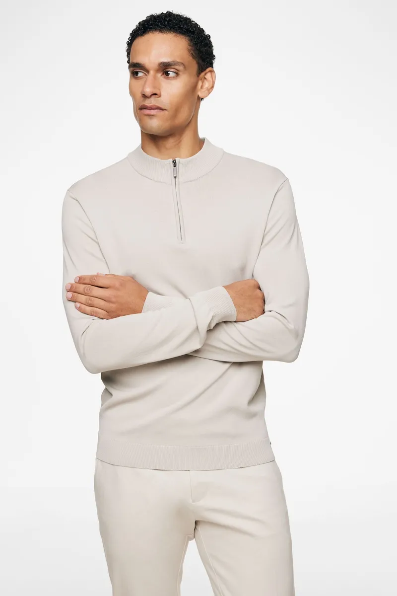 Beige half zip structuur